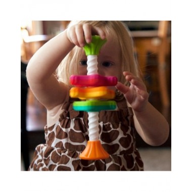 MiniSpinny žaislas kūdikiams - mergaitė žaidžianti su žaislu