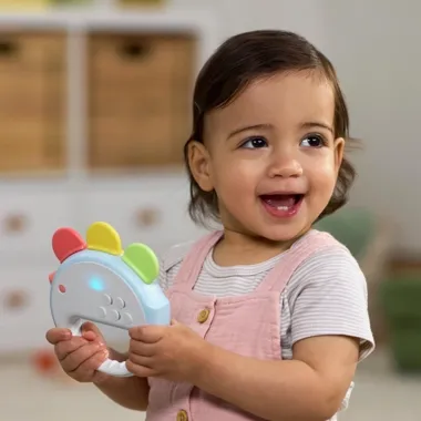 Skip Hop muzikinis žaislas kūdikiams Viščiukas ir besišypsanti mergaitė