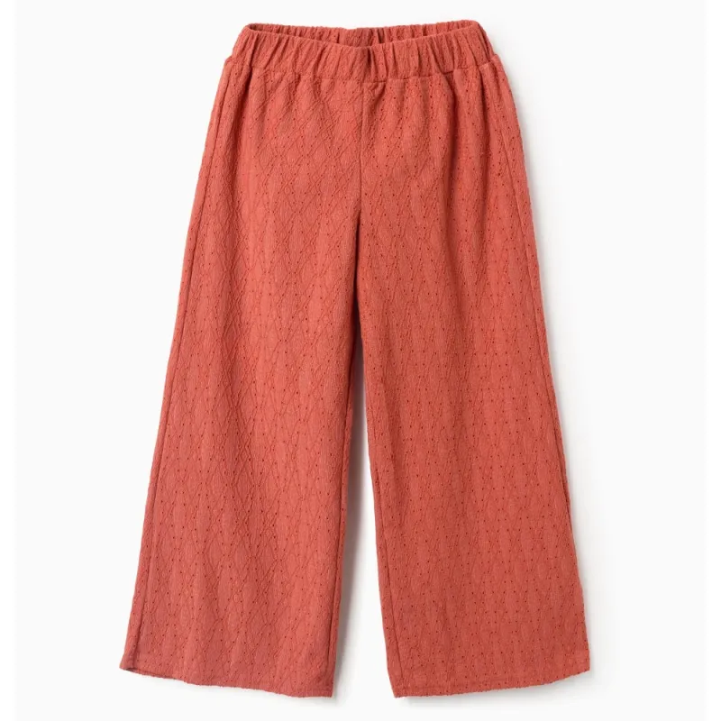 Oranžinės plačios kelnės mergaitei Oranžinės plačios kelnės mergaitei