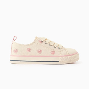 Šviesūs smėlio spalvos sportbačiai mergaitei su gėlių motyvu