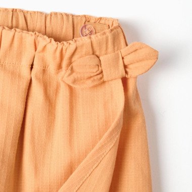 Medvilniniai šortai mergaitei su dekoratyviniu kaspinu