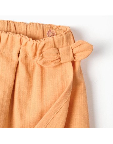 Oranži šorti–svārki (6/9–24/36 mēn.)